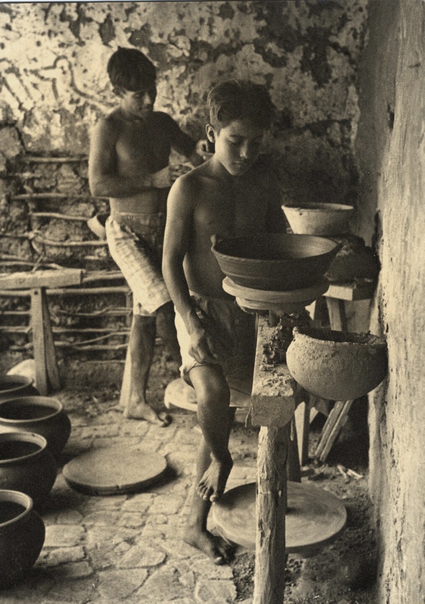 Father and Son at Pottery Wheels