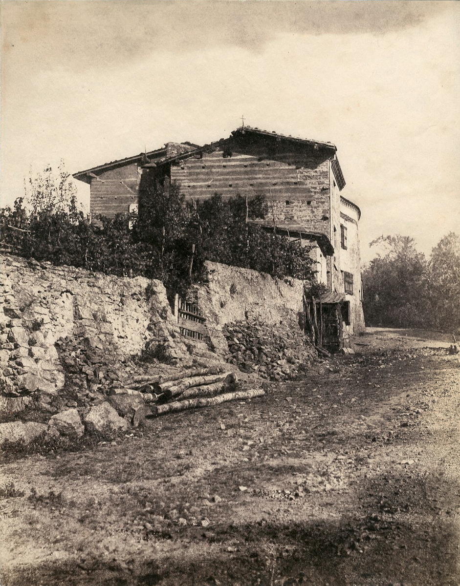 House with iron cross on roof