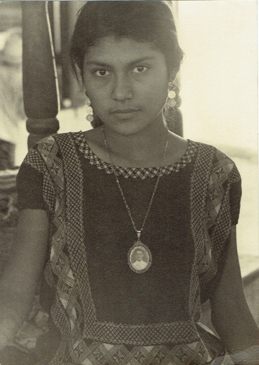 Girl wearing portrait locket