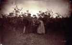 Two Women with Baskets in Field