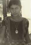 Girl wearing portrait locket